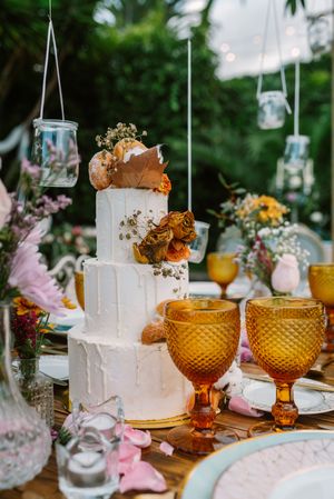 Wedding table decoration in rustic style placed outdoors