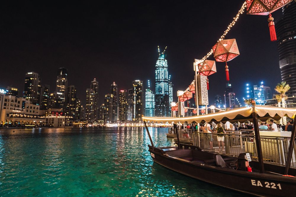 Boat and embankment in night metropolis
