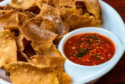 Mexican corn chips with salsa sauce