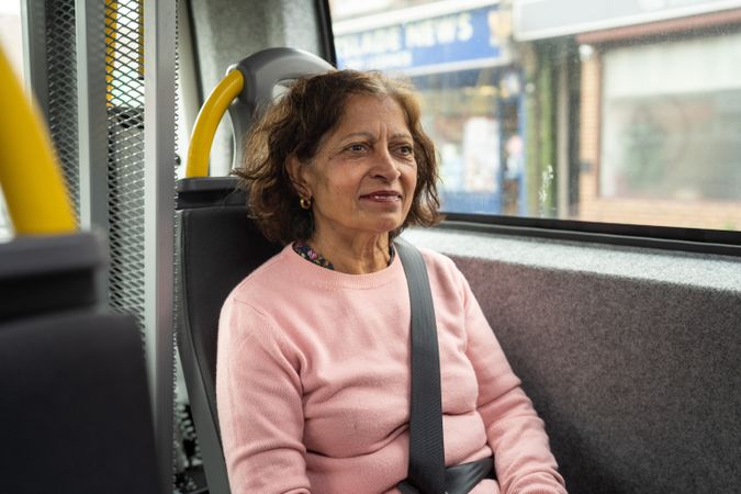 Indian woman sitting on bus