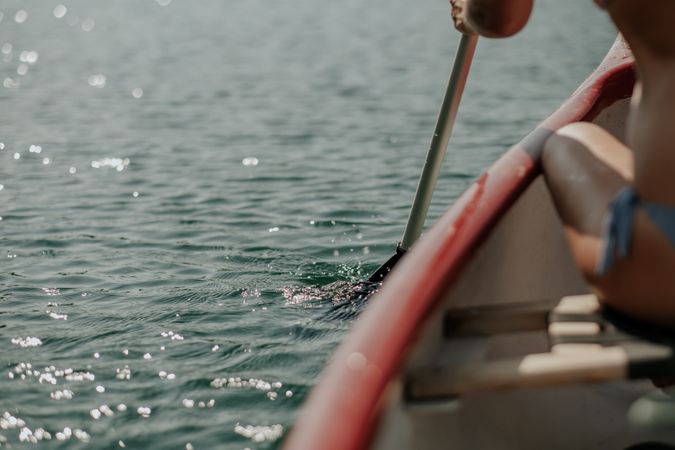 Woman paddling in ocean
