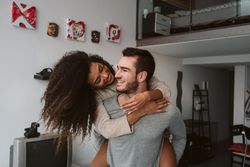 Multiracial couple having fun at home