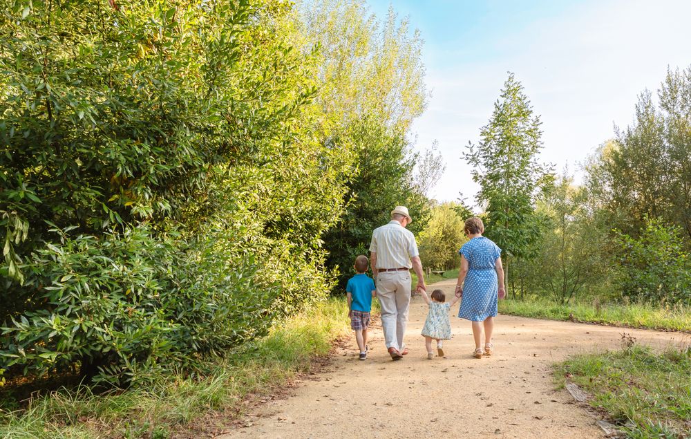 Grandparents and grandchildren walking outdoors