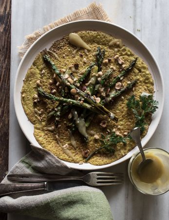 Served vegetarian crepe with oats and asparagus