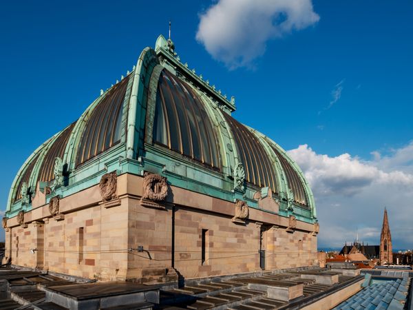 Roofs of the city of Strasbourg. Library building. St Paul's Cathedral.