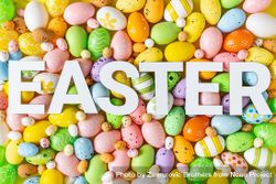 Texture of pastel eggs with “EASTER” text 4MgOr0