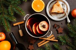 Top view of mulled wine and pie