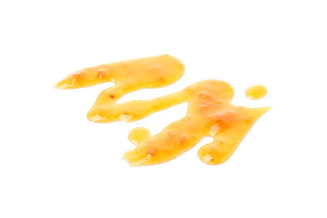 Delicious apricot jam isolated on plain background