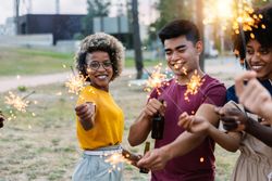 Happy young friends having fun in party celebration