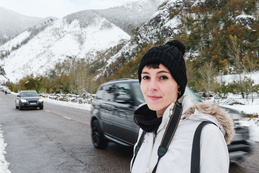 Woman visiting mountains in winter