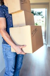Man carrying moving boxes