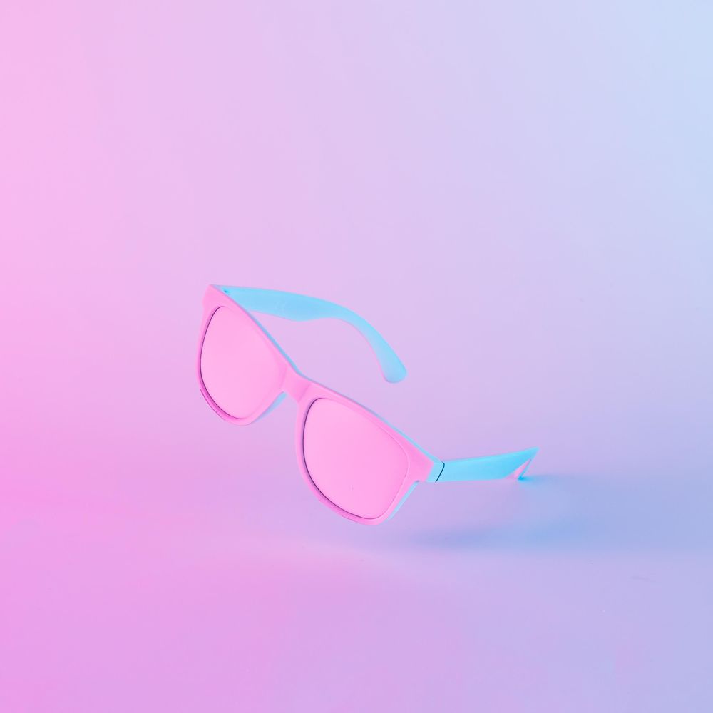 Sunglasses in vibrant bold gradient purple and blue holographic colors
