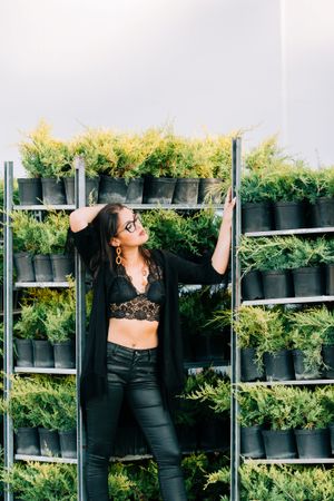 young female in greenhouse