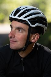 Positive cyclist looking away in park