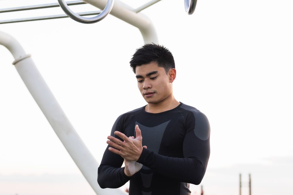 Athletic man with powdered hands