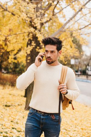 Stylish male talking on mobile phone