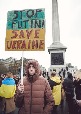 London, England, United Kingdom - March 5 2022: Man with “Stop Putin, Save Ukraine” sign
