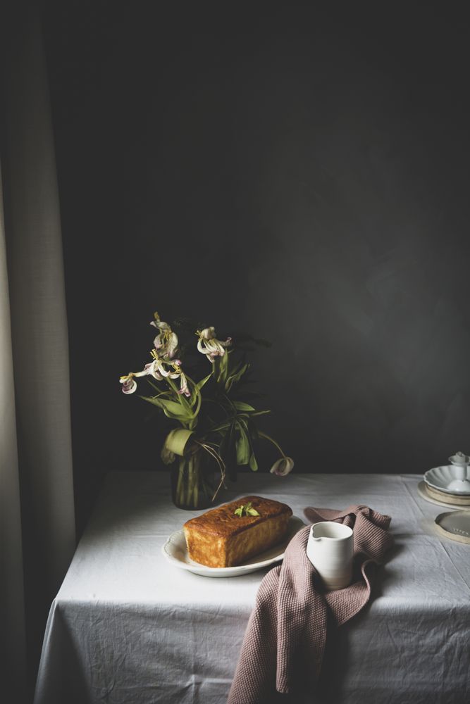 Cake with lemon on table