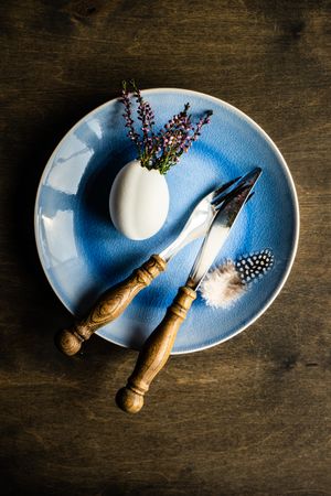 Heather in decorative egg on blue plate