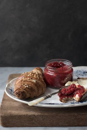 Served breakfast meal with sandwich and jam