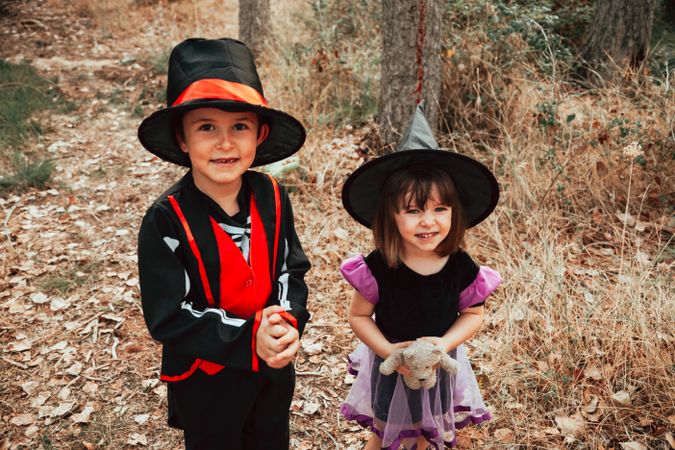 Brother and sister ready to trick or treat