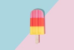 Ice cream popsicle in pastel pink on paper duotone background