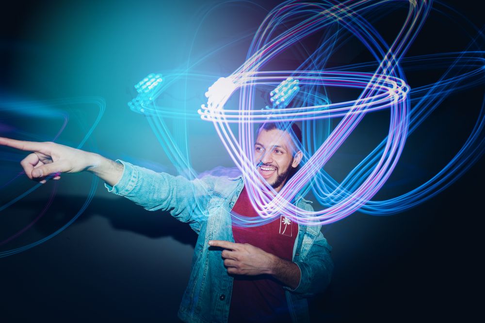bearded man dancing in spotlight