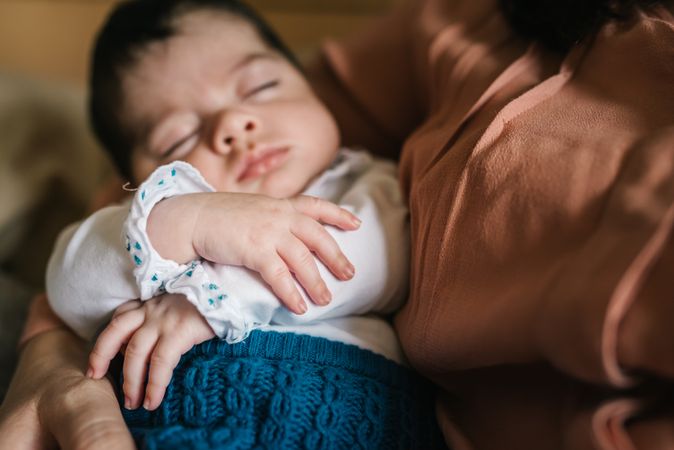 Mother holding baby in arms