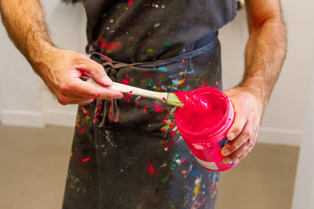 male artist preparing paints