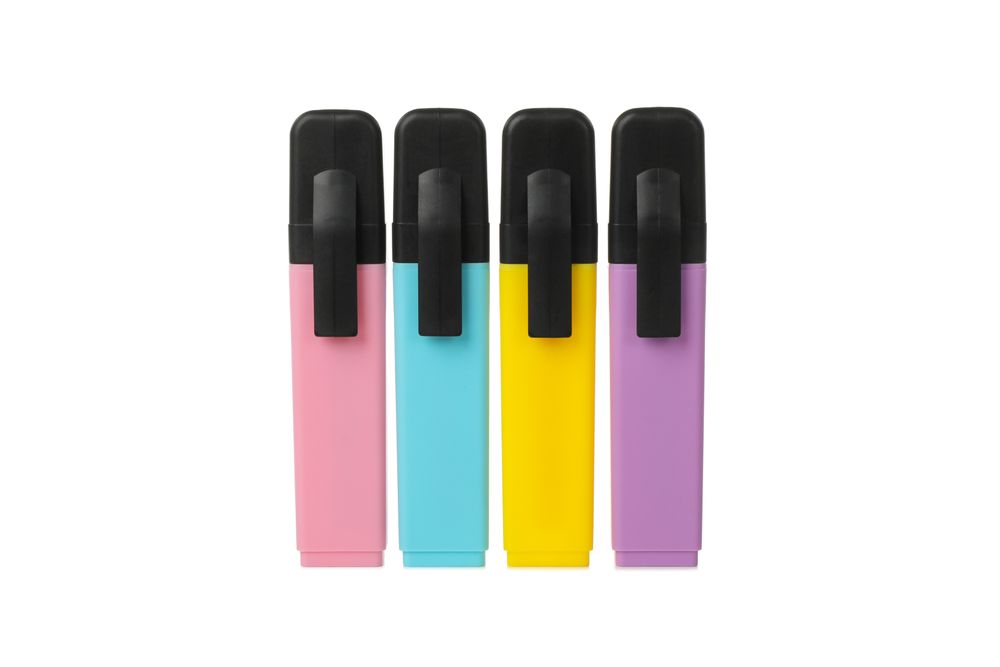 Different color highlighters isolated on blank background