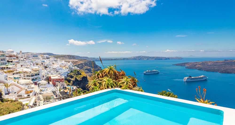 Pool over looking Aegean Sea with two cruise ships