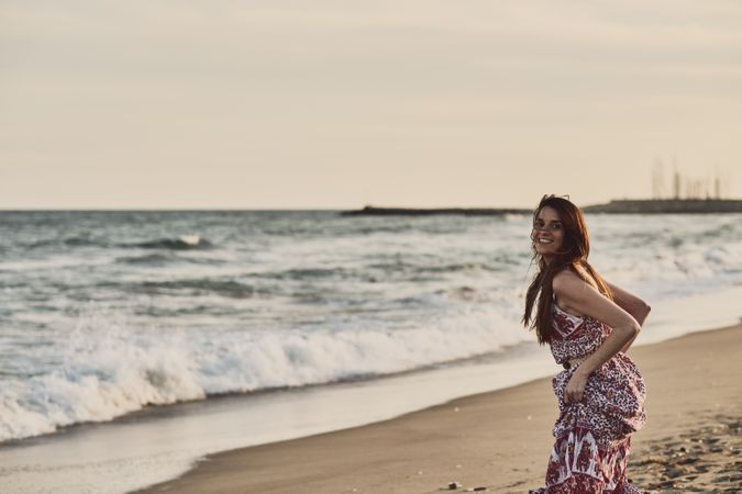 Smiling young woman on beach
