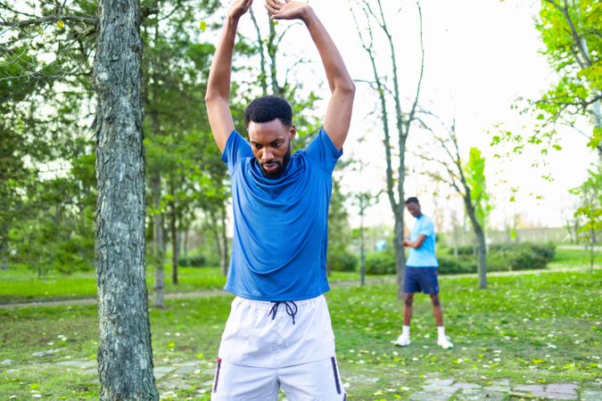 Commitment and Consistency: Black Trainer Leading Fitness Class with Copy Space