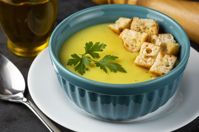 Bowl with onion soup and croutons on the table.