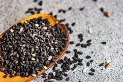 Sesame seeds in the wooden spoon