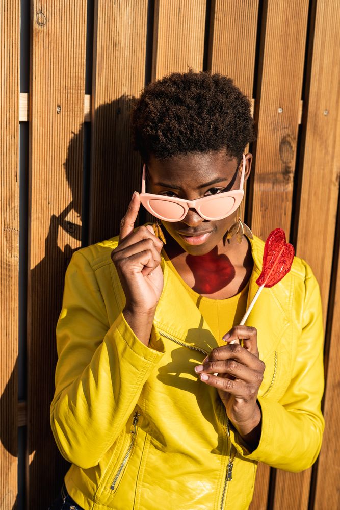 Black woman eating candy