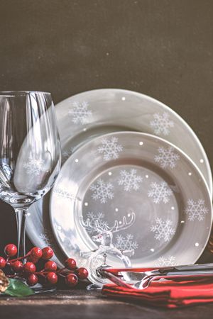 Christmas table setting with grey themed plates