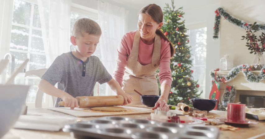 Portrait of Woman and her Son Baking Together During Christmas.