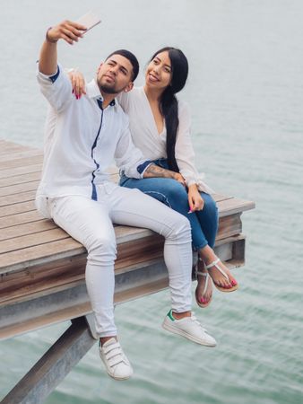 Woman with man taking photo selfie