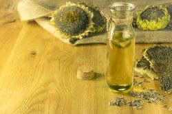 Bottle with sunflower oil in rustic settings