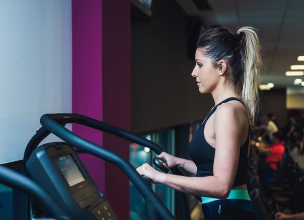 woman on exercise machine