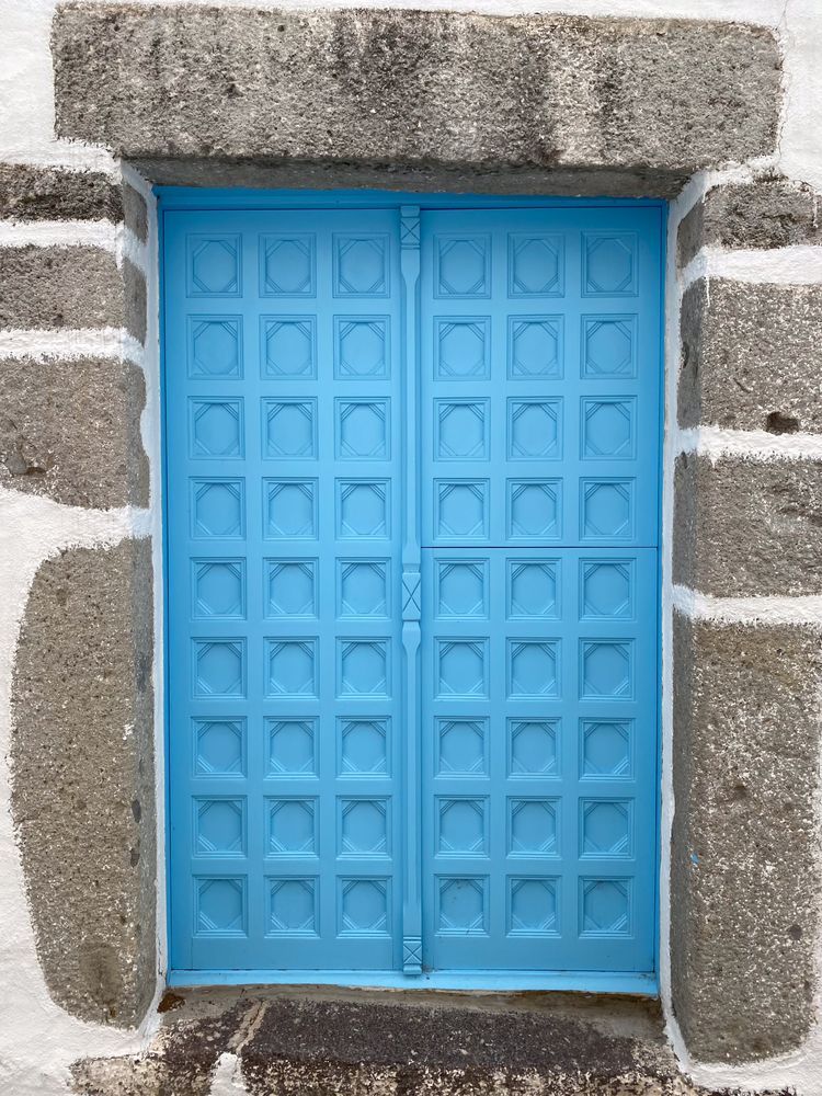 Patmian blue door with geometrical mouldings