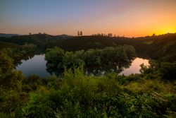 Peaceful river flowing in green nature