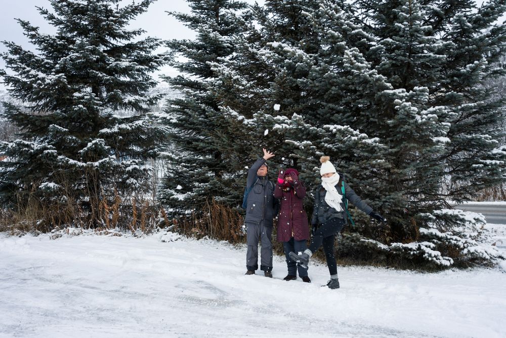 Family playing with snowballs