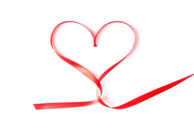 Red ribbon heart isolated on blank background