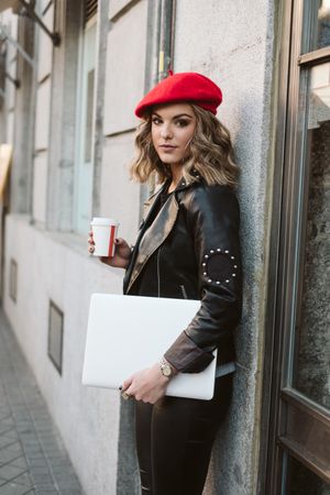 Woman with drink on the street