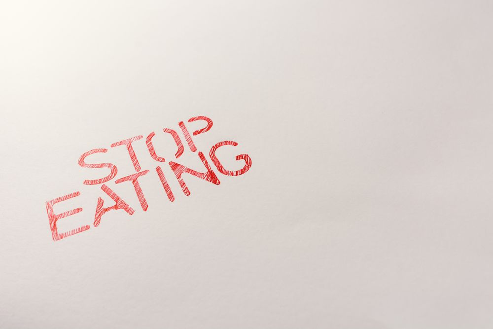 Simple red inscription calling to stop eating