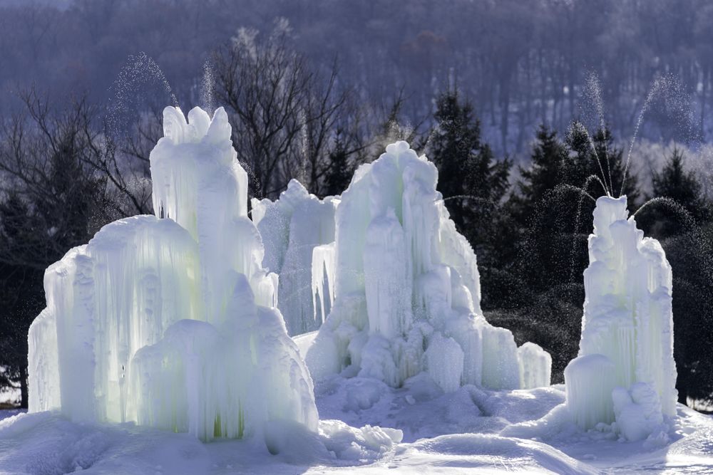 Ice structures against the forest in the wintertime