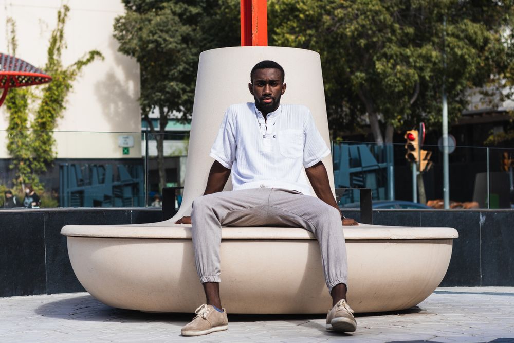 Stylish Black man in city street