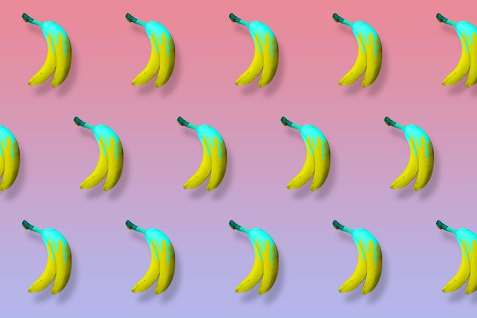 Yellow bananas with dripping blue paint